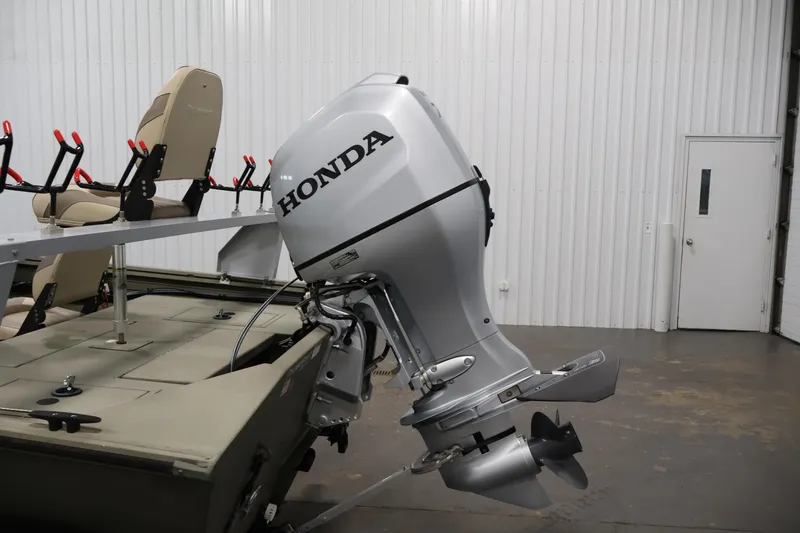 Slide: The Image of 2021 Polar Kraft Sportsman 1760 SE boat with Honda outboard motor in a garage. - 37