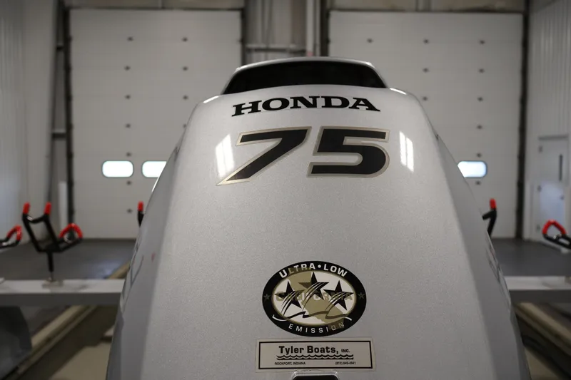 Slide: The Image of Honda 75 outboard motor on 2021 Polar Kraft Sportsman 1760 SE boat in garage. - 39