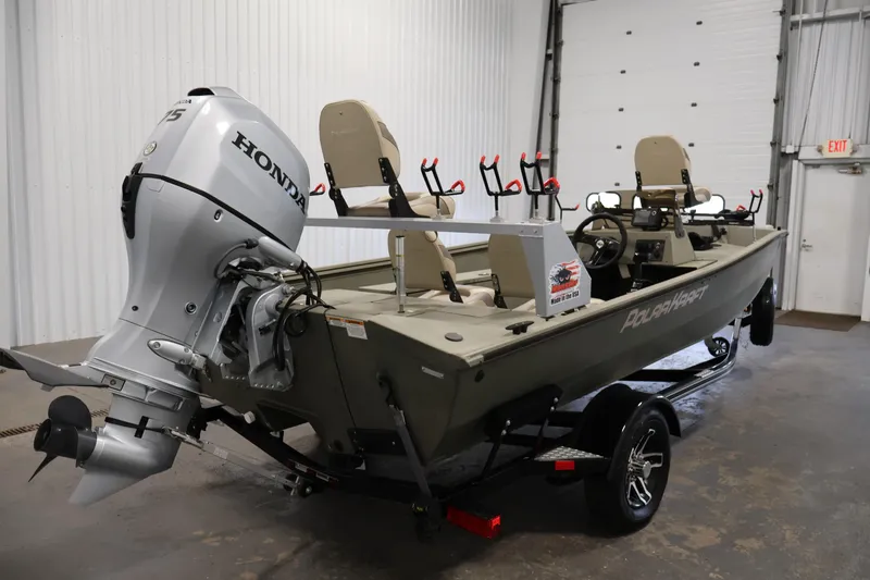 Slide: The Image of 2021 Polar Kraft Sportsman 1760 SE boat with Honda outboard motor in a garage setting. - 5