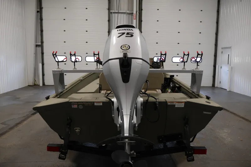 Slide: The Image of 2021 Polar Kraft Sportsman 1760 SE boat with Honda 75 engine in a garage. - 6