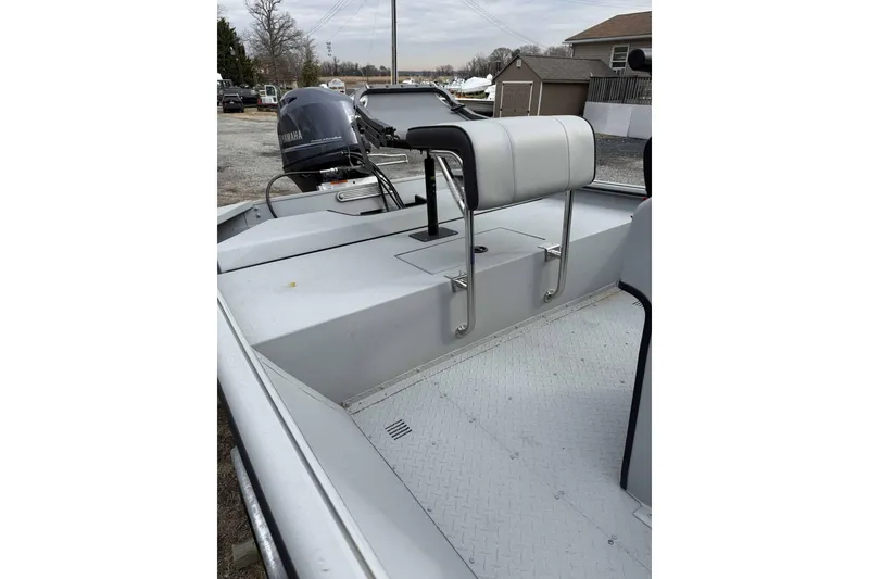 Slide: The Image of 2025 SeaArk Shadow 18T boat interior with Yamaha motor, featuring a sleek, modern design. - 6