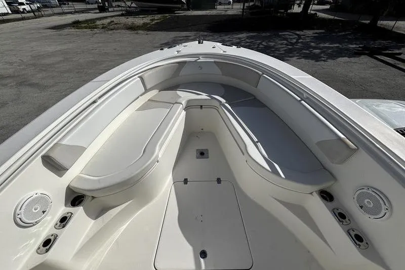Slide: The Image of 2013 Edgewater 318CC boat interior with spacious seating and storage compartments. - 15