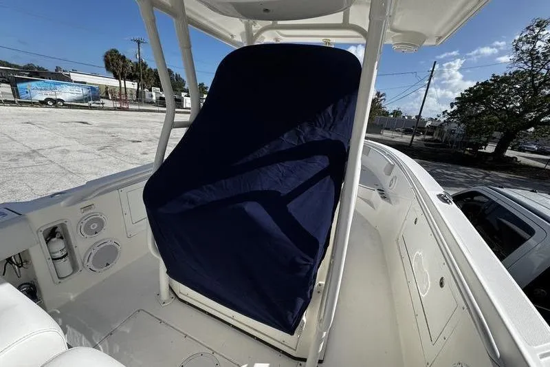 Slide: The Image of 2013 Edgewater 318CC boat helm covered with a navy blue fabric. - 26