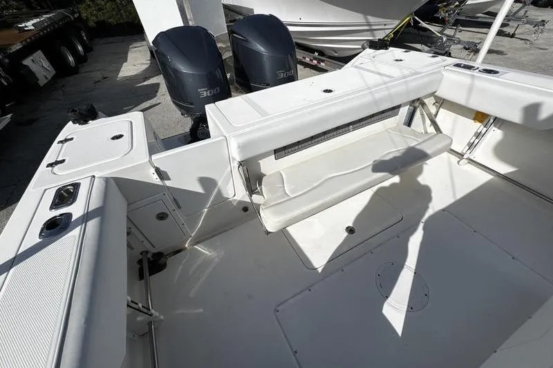 Slide: The Image of 2013 Edgewater 318CC boat interior with dual 300 horsepower engines. - 31