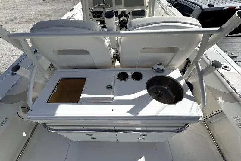 Slide: The Image of 2013 Edgewater 318CC boat interior with seating and utility station. - 4