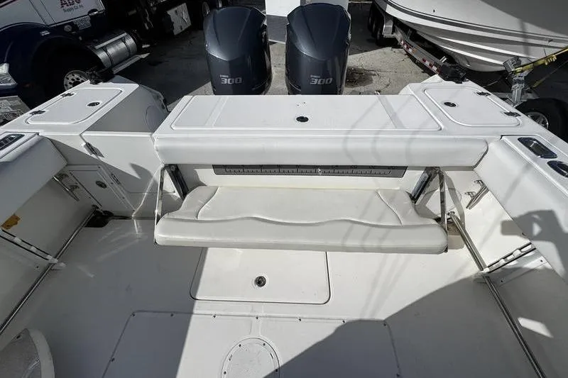 Slide: The Image of 2013 Edgewater 318CC boat interior with dual 300 horsepower engines. - 8