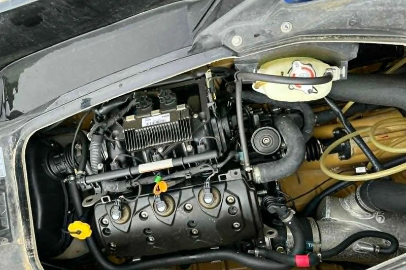 Slide: The Image of Engine compartment of a 2011 Sea-Doo GTI SE 155, showcasing detailed mechanical components. - 6