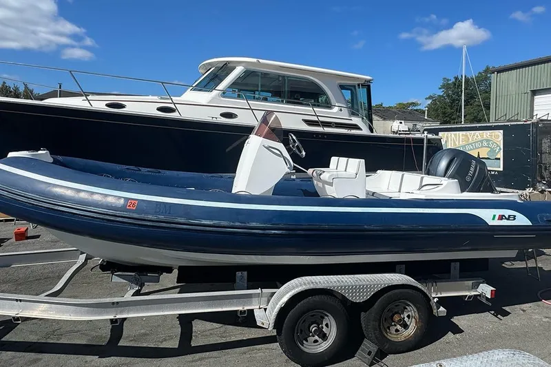 The Image of 2020 AB Inflatables Oceanus 21 VST boat on trailer, parked outdoors under blue sky. - 1
