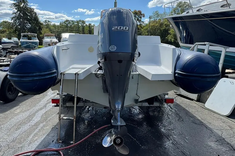 Slide: The Image of 2020 AB Inflatables Oceanus 21 VST with Yamaha 200 engine, parked on a trailer. - 10