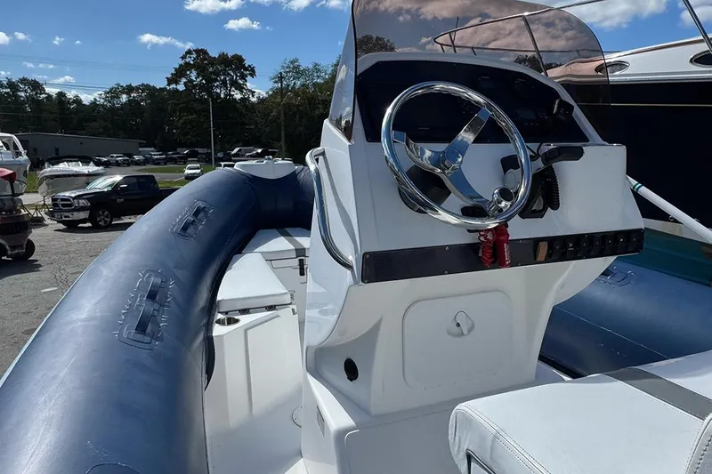Slide: The Image of 2020 AB Inflatables Oceanus 21 VST boat with steering console and blue inflatable sides. - 14