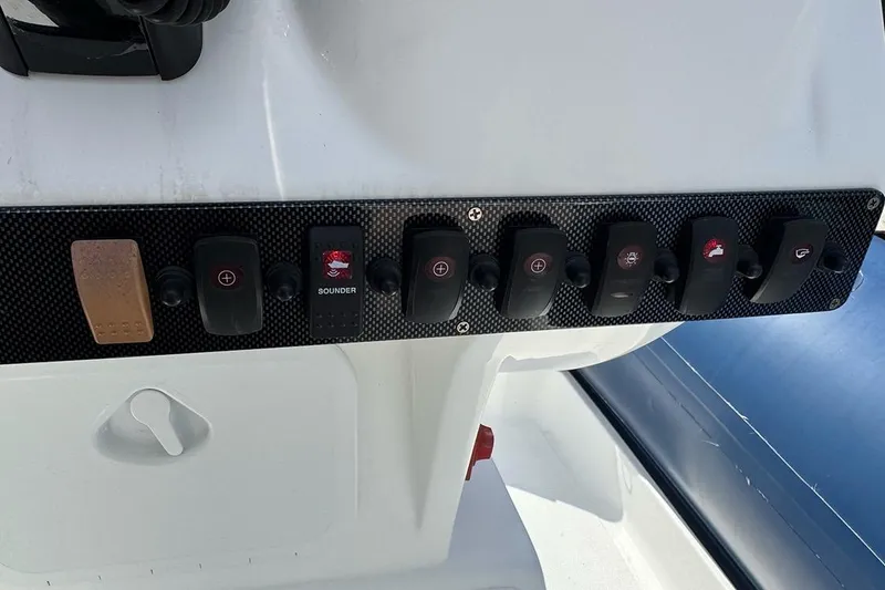 Slide: The Image of Control panel of a 2020 AB Inflatables Oceanus 21 VST boat with multiple switches. - 18