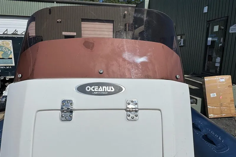 Slide: The Image of 2020 AB Inflatables Oceanus 21 VST boat with windshield, parked outside a building. - 26