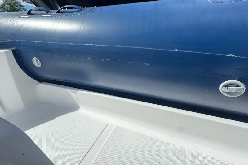 Slide: The Image of 2020 AB Inflatables Oceanus 21 VST boat interior, featuring blue and white design. - 27