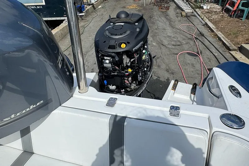 Slide: The Image of 2020 AB Inflatables Oceanus 21 VST boat with exposed engine, docked outdoors. - 34