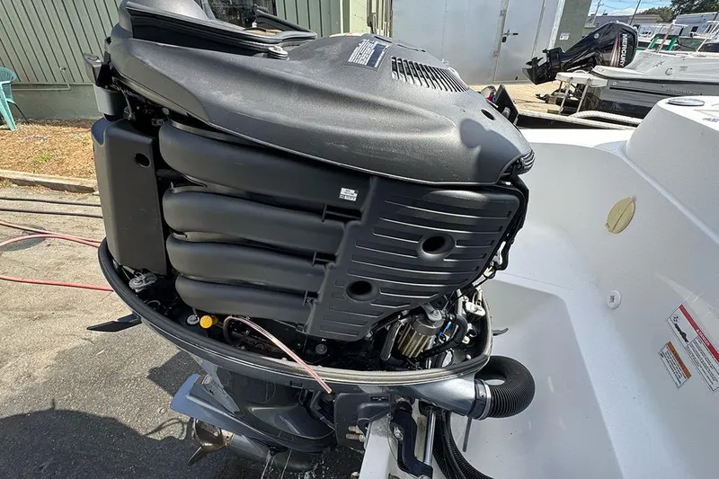 Slide: The Image of 2020 AB Inflatables Oceanus 21 VST boat engine detail in a marina setting. - 35