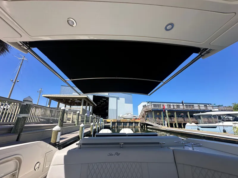 Slide: The Image of Interior view of 2023 Sea Ray SLX 310 Outboard with sunshade. - 13