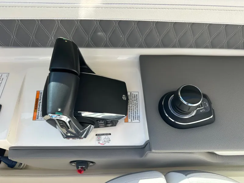 Slide: The Image of Control console of 2023 Sea Ray SLX 310 Outboard with controls. - 17