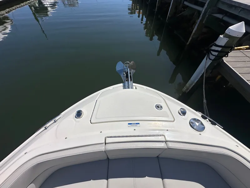 Slide: The Image of Bow view of 2023 Sea Ray SLX 310 Outboard at dock. - 24