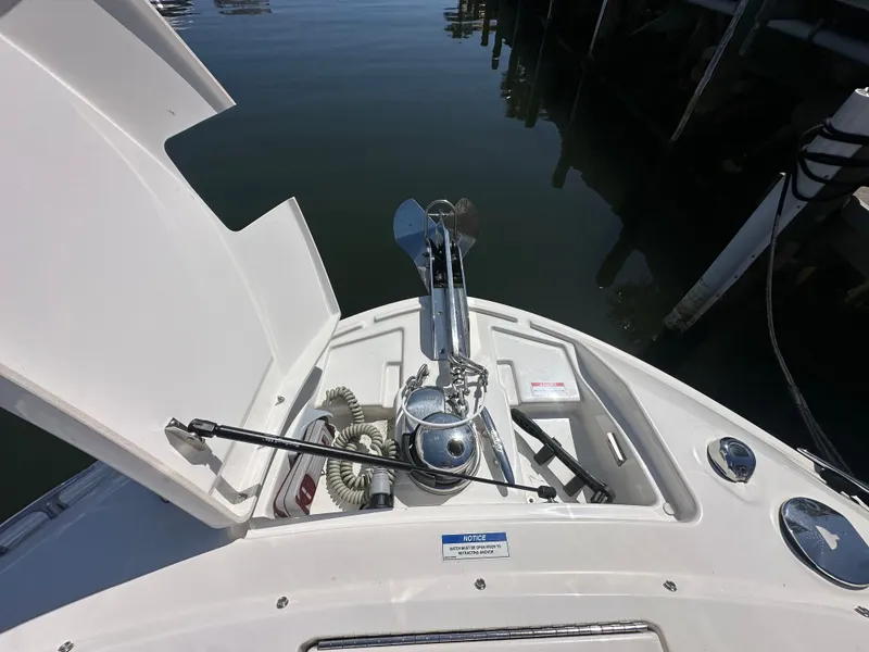 Slide: The Image of Anchor area of the 2023 Sea Ray SLX 310 Outboard. - 25