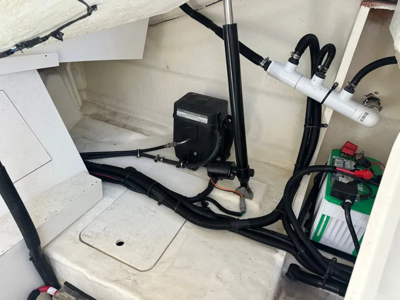 Slide: The Image of Interior of 2023 Sea Ray SLX 310 Outboard with wiring and battery. - 28