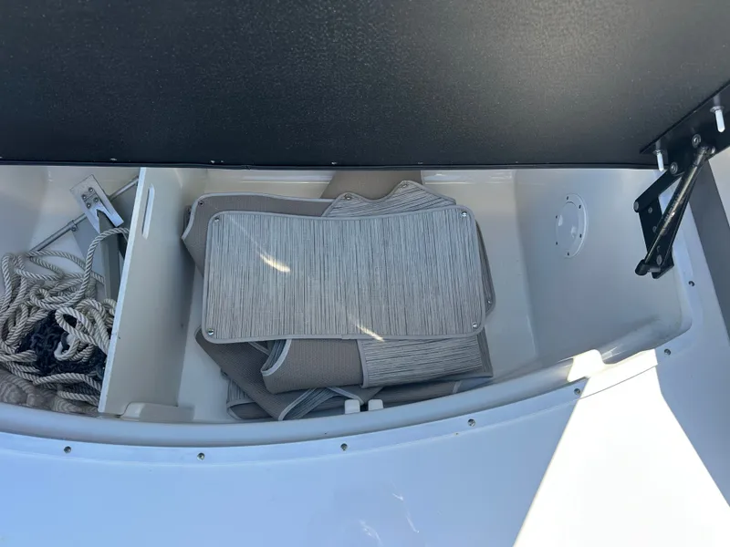 Slide: The Image of Storage compartment in Sea Ray SLX 310 Outboard 2023 boat. - 31