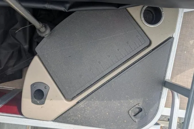 Slide: The Image of 2022 Sun Tracker Fishin' Barge 20 DLX deck with storage compartments and cup holder. - 11