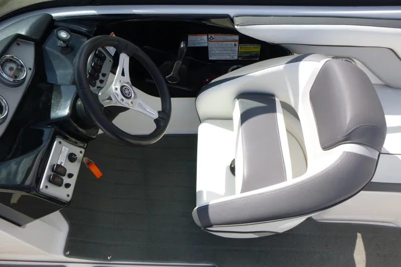 Slide: The Image of 2015 Yamaha Boats SX192 cockpit with steering wheel and cushioned seat. - 11