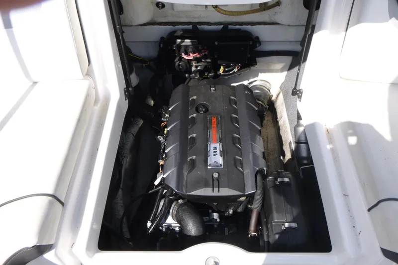 Slide: The Image of Engine compartment of a 2015 Yamaha Boats SX192, showcasing the internal mechanics. - 13