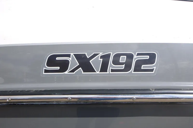 Slide: The Image of 2015 Yamaha Boats SX192 logo on a gray and white boat exterior. - 14