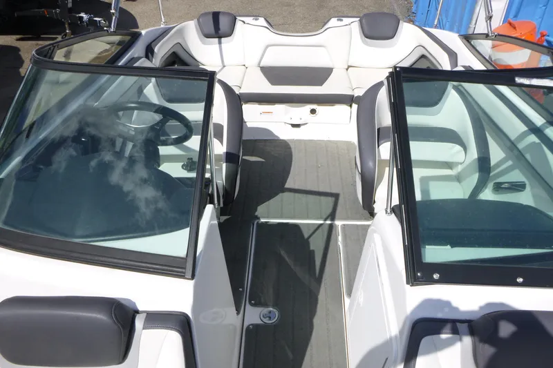 Slide: The Image of 2015 Yamaha Boats SX192 interior with dual windshields and seating. - 8