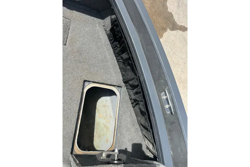 Slide: The Image of 2017 Tracker Targa V-18 Combo boat interior storage compartment. - 13