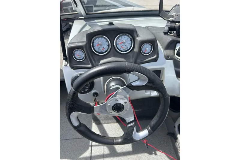 Slide: The Image of Steering wheel and dashboard of 2017 Tracker Targa V-18 Combo boat. - 18