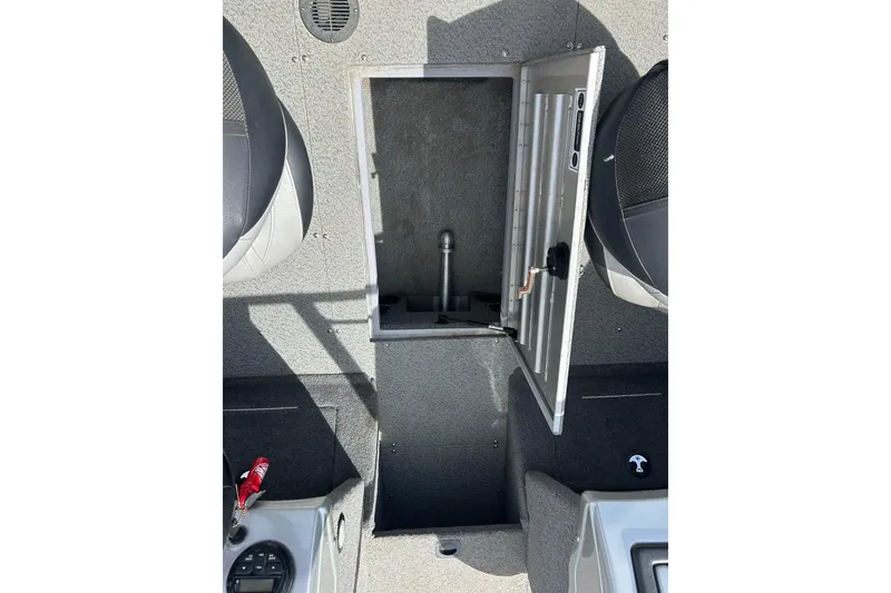 Slide: The Image of 2017 Tracker Targa V-18 Combo boat interior with open storage compartment. - 21