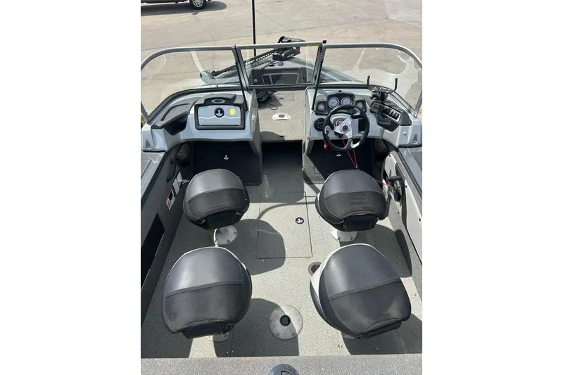 Slide: The Image of 2017 Tracker Targa V-18 Combo boat interior with four seats and control panel. - 22
