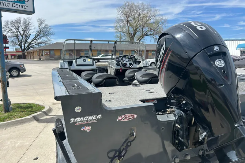 Slide: The Image of 2017 Tracker Targa V-18 Combo boat with Mercury outboard motor in a parking lot. - 3