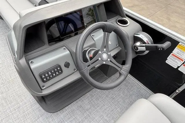 Slide: The Image of 2026 Sun Tracker Party Barge 20 DLX steering console with modern controls and sleek design. - 10