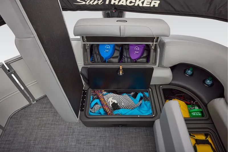 Slide: The Image of Manufacturer Provided Image: 2026 Sun Tracker Party Barge 20 DLX interior storage compartments with life jackets and accessories. - 21