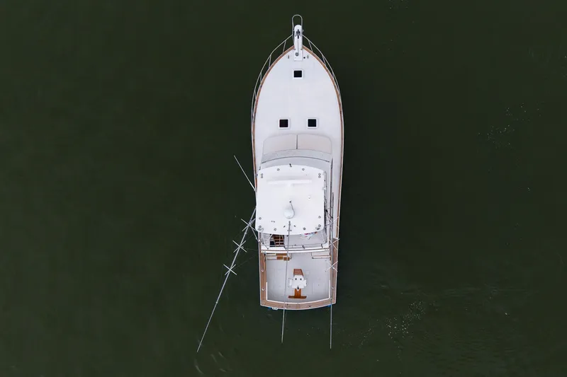 Slide: The Image of Aerial view of 1982 Post 46 Convertible boat on calm water. - 16