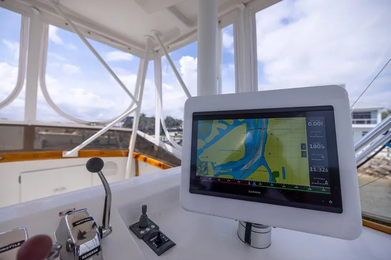 Slide: The Image of Control panel of a 1982 Post 46 Convertible boat with navigation display. - 19
