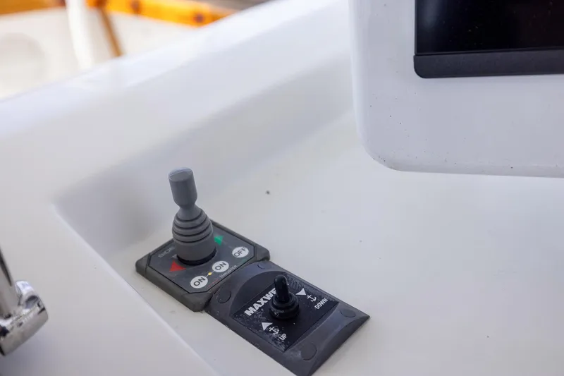 Slide: The Image of Control panel of a 1982 Post 46 Convertible boat with joystick and switches. - 22