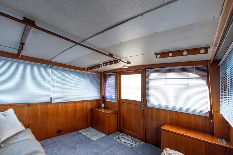 Slide: The Image of Interior of 1982 Post 46 Convertible yacht with wood paneling and blinds. - 36