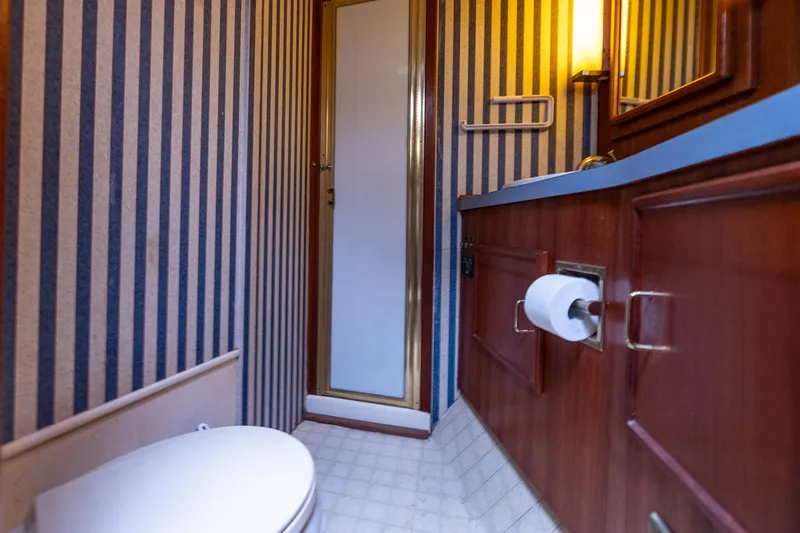 Slide: The Image of Bathroom in 1982 Post 46 Convertible with striped wallpaper. - 43