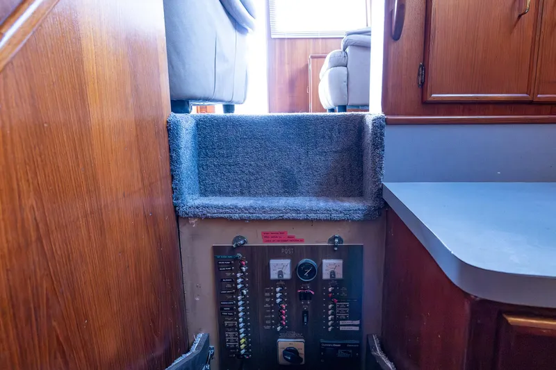 Slide: The Image of Interior view of 1982 Post 46 Convertible yacht with carpeted steps and control panel. - 50