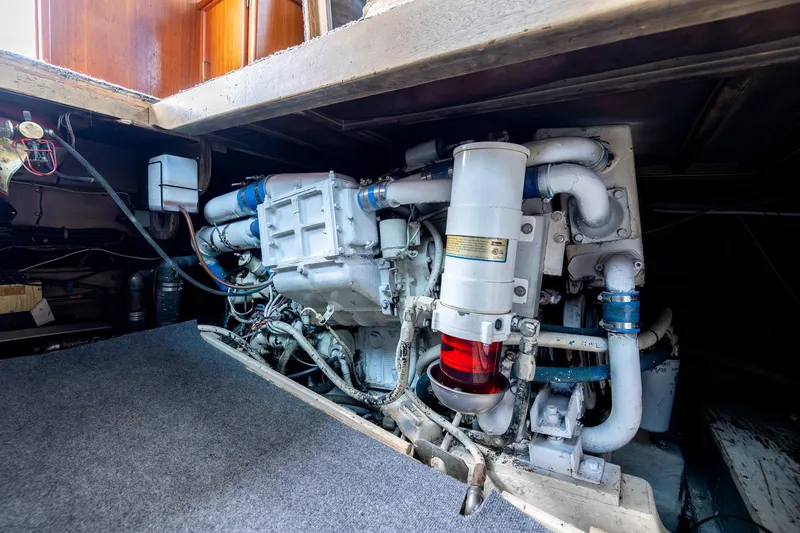 Slide: The Image of Engine room of a 1982 Post 46 Convertible boat, showcasing mechanical components. - 53