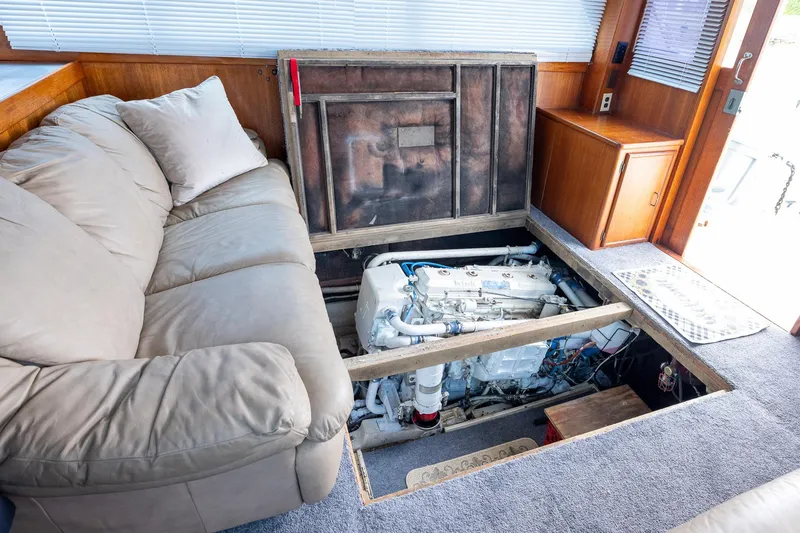 Slide: The Image of Interior of 1982 Post 46 Convertible yacht showing engine under floor panel. - 54