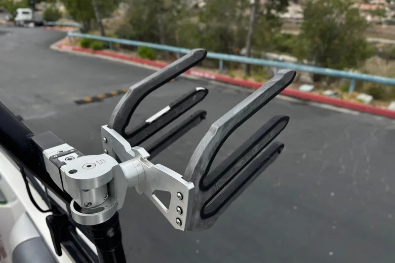 Slide: The Image of Wakeboard rack on a 2016 Moomba Craz boat, mounted securely on a metal pole. - 16