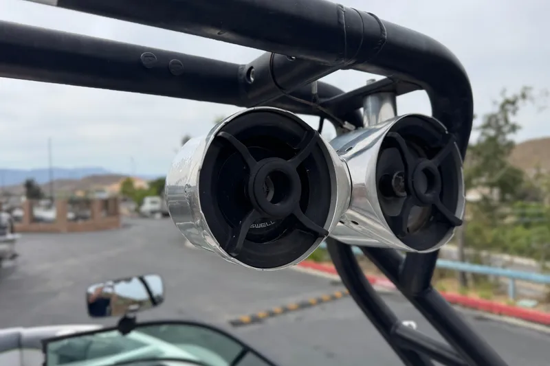 Slide: The Image of 2016 Moomba Craz boat speakers mounted on a black tower, outdoor setting. - 17