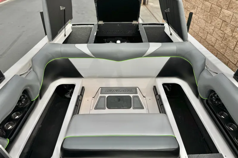 Slide: The Image of 2016 Moomba Craz boat interior with gray seating and storage compartments. - 19