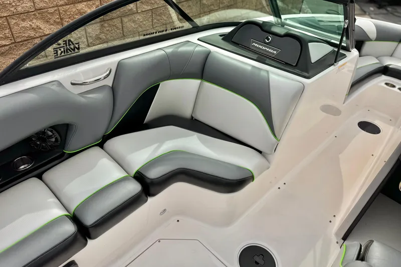 Slide: The Image of 2016 Moomba Craz boat interior with gray and white seating, green accents. - 22