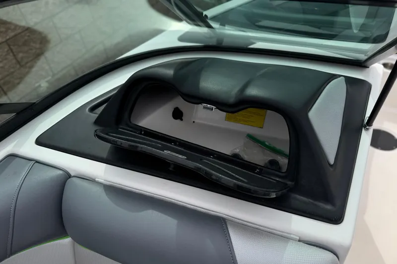 Slide: The Image of 2016 Moomba Craz boat dashboard storage compartment with open lid. - 25